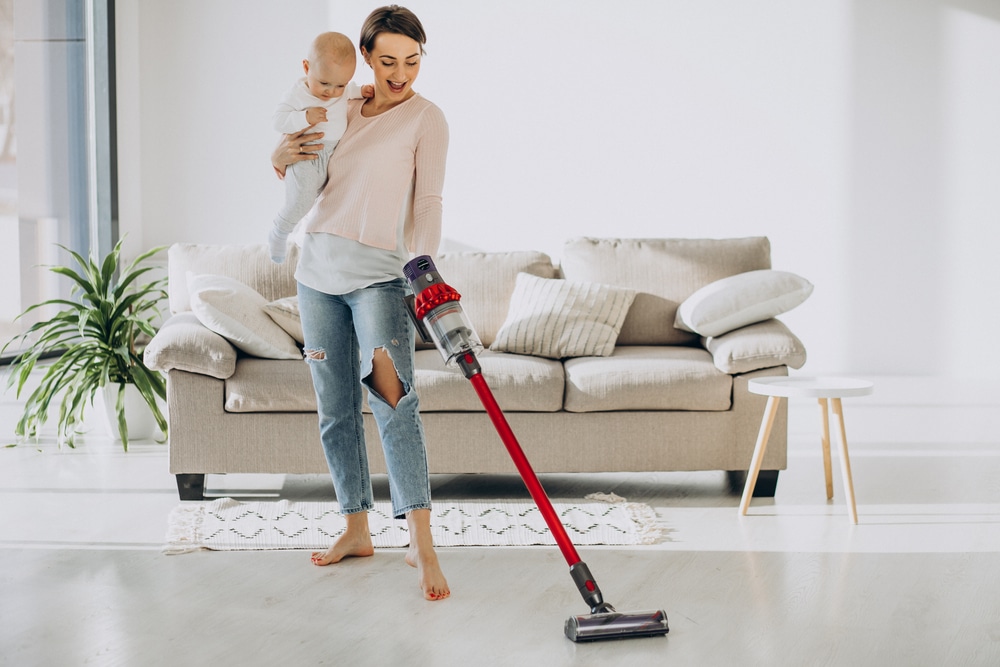 Young,Mother,With,Toddler,Son,Cleaning,Up,At,Home